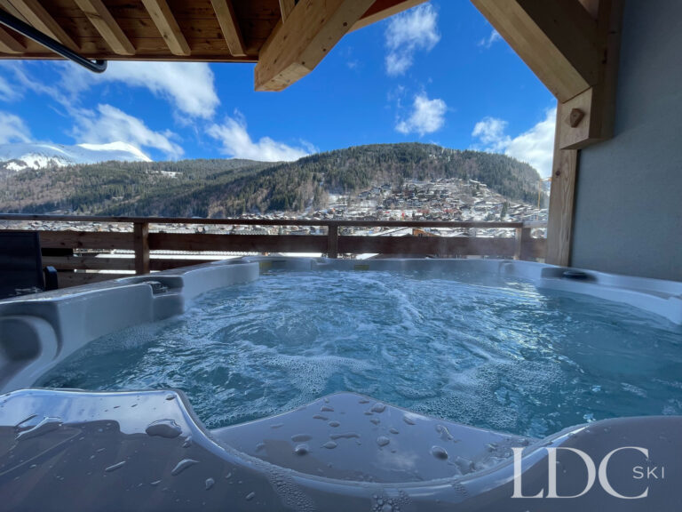 Piste Noire hot tub with panoramic mountain views over Morzine