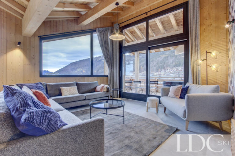 Piste Noire lounge with large windows and mountain views over Morzine