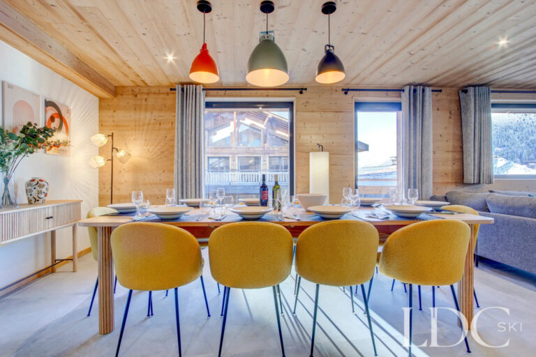 Piste Rouge dining area with contemporary pendant lighting