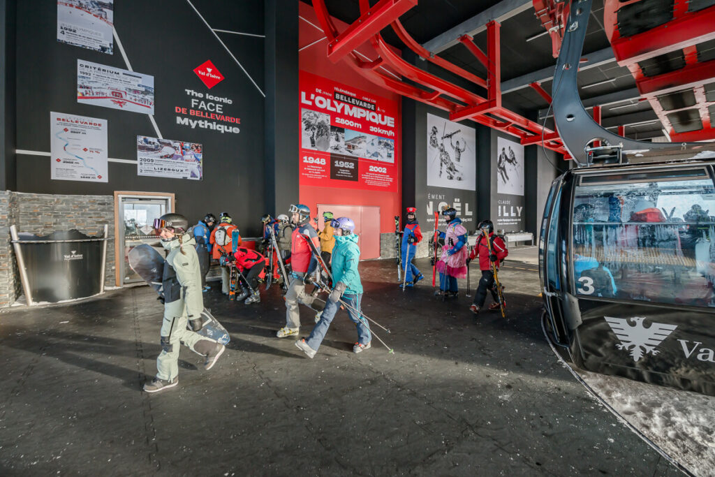 Skiers boarding a lift in the Val d'Isère ski area. © Anna Cantu