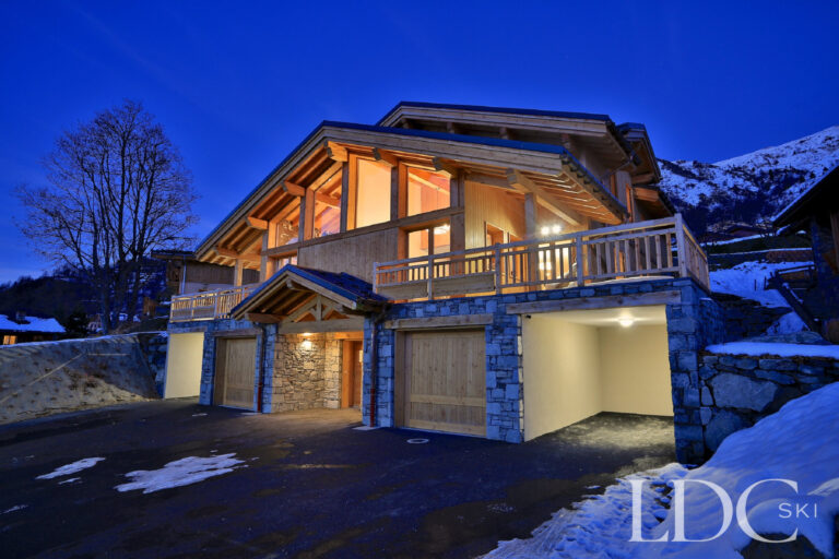 Chalet building illuminated at dusk in St Martin de Belleville