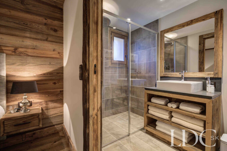 Ensuite shower room with timber detailing at Chalet Chez Bugi