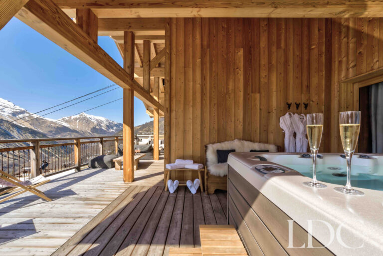 Private hot tub on the terrace overlooking the mountains at Chalet Chez Bugi