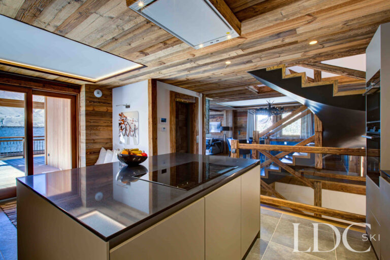 Open kitchen looking through towards the main living area at Chalet Chez Bugi
