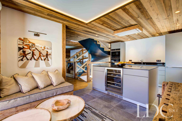 Informal snug opening onto the contemporary kitchen at Chalet Chez Bugi