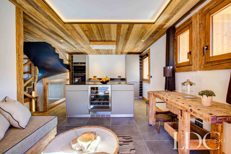 Informal snug opening onto the contemporary kitchen at Chalet Chez Bugi