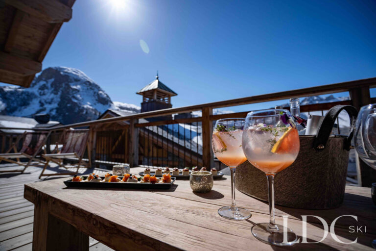 Drinks and canapés on the terrace overlooking the mountains at Chalet Chez Bugi