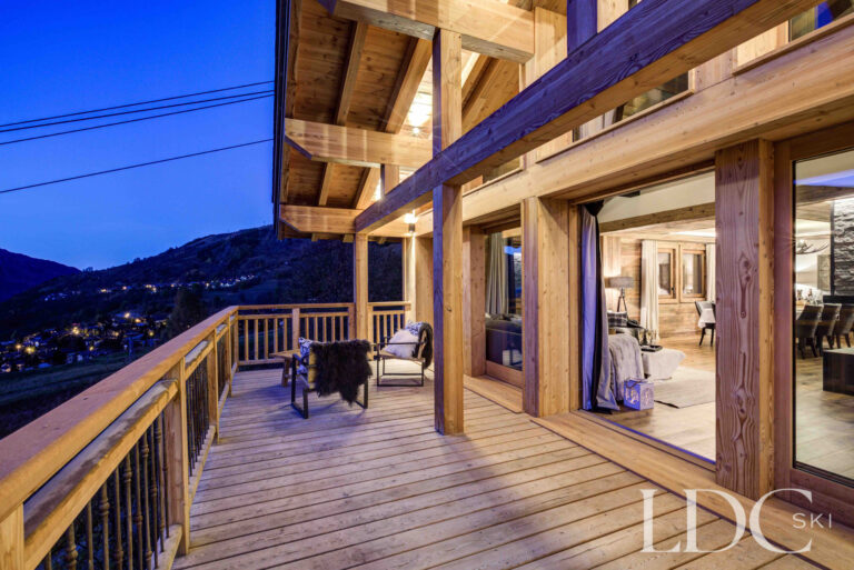 Chalet terrace overlooking the mountains at dusk in St Martin de Belleville