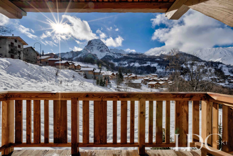 Snowy village and mountain view from Chalet Constantia