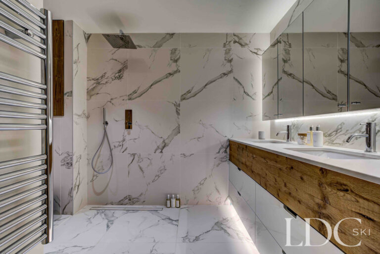 Marble ensuite bathroom with walk-in shower at Chalet Constantia
