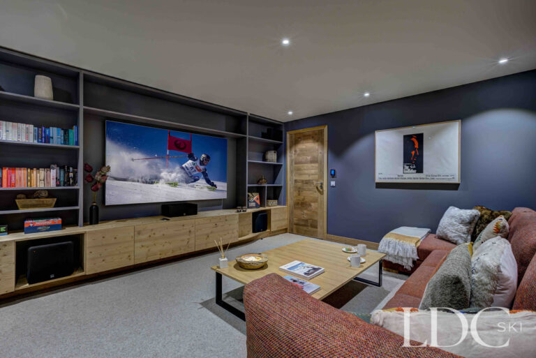 Private cinema room with large screen and comfortable seating at Chalet Constantia