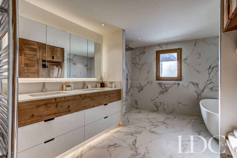 Spacious marble-finished master bathroom at Chalet Constantia