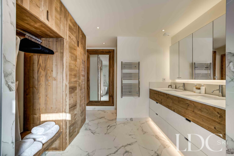 Spacious master bathroom with freestanding bath, walk-in shower and generous floor space at Chalet Constantia