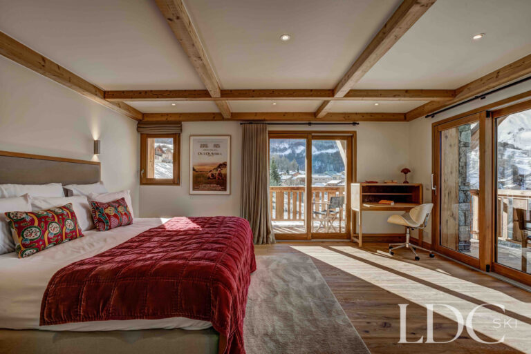 Spacious master bedroom with sitting area and mountain views at Chalet Constantia