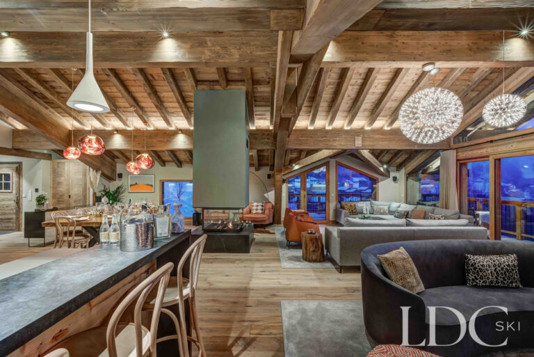 Expansive open-plan living space beneath the vaulted timber ceiling at Chalet Constantia