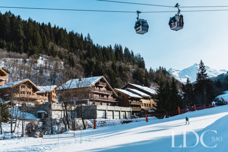 Ski piste and gondolas beside Chalet Pasarale in Méribel, showing its convenient ski location
