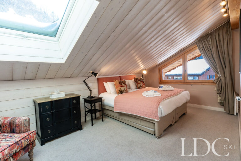 Double bedroom with skylight at Chalet Quatre Meules