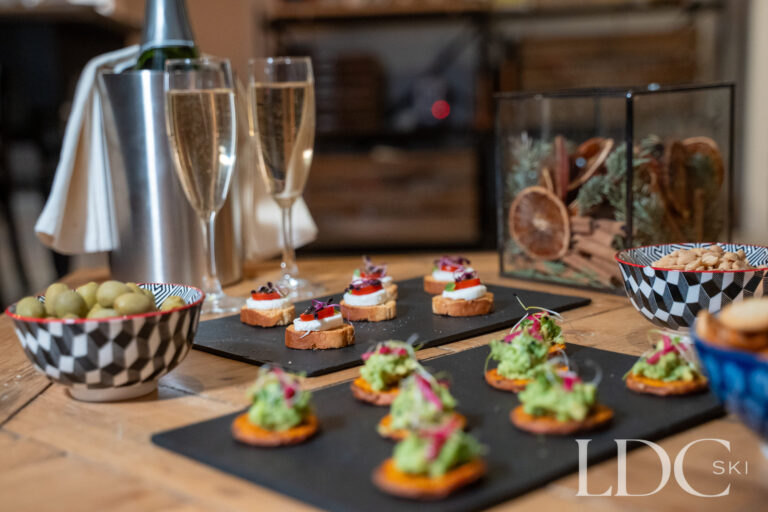 Evening canapés and complimentary drinks served at catered Chalet Quatre Meules