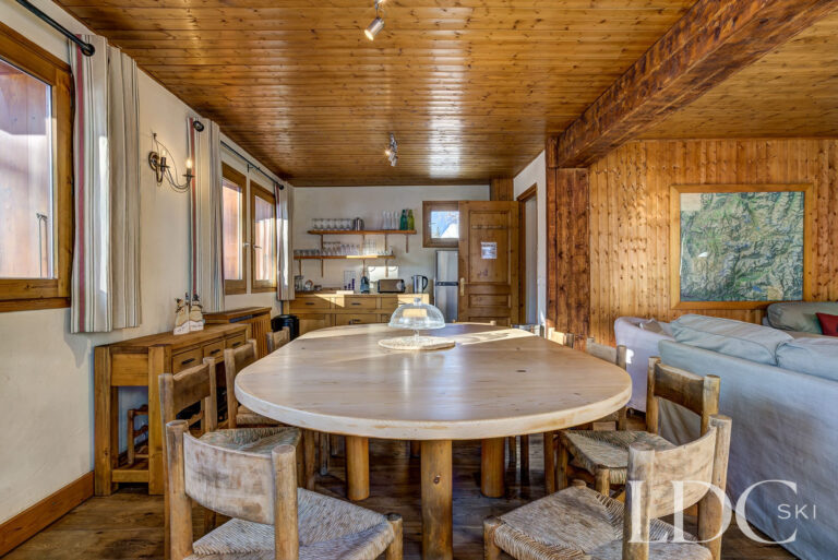 Traditional wooden dining area beside the open-plan living space at Chalet Veronica