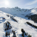 Aerial winter view across Jardin Alpin and the surrounding Courchevel ski area. © Instapades Studio
