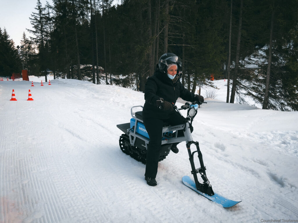 Moonbike rider enjoying a winter activity on the snow in Courchevel. © Courchevel Tourisme