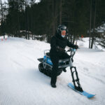 Moonbike rider enjoying a winter activity on the snow in Courchevel. © Courchevel Tourisme