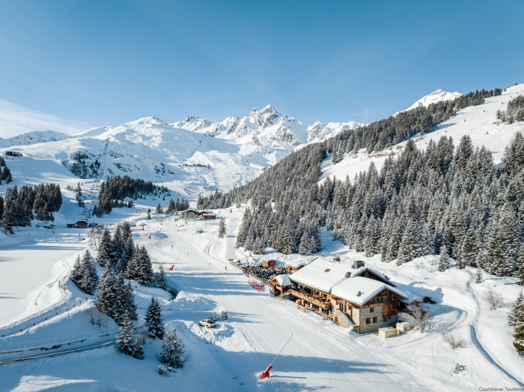 Aerial view across the snowy pistes and lifts of the Courchevel ski area. © Courchevel Tourisme