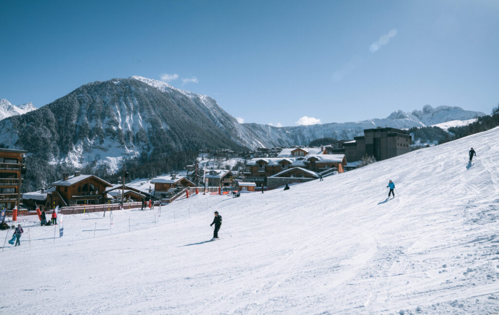 Aerial winter view across Courchevel Village and the surrounding ski slopes. © Un Duo.