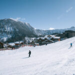 Aerial winter view across Courchevel Village and the surrounding ski slopes. © Un Duo.