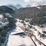 Winter view across Courchevel Village and the surrounding snow-covered mountains. © Un Duo.