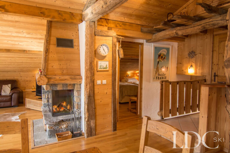 Traditional stone fireplace and timber interior at Encombres Tête de Fer