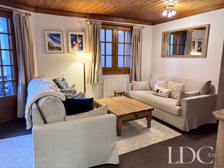 Relaxed seating area with wooden coffee table at Iris