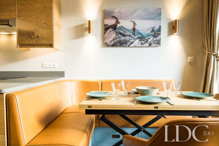 Contemporary dining area with banquette seating at La Florette