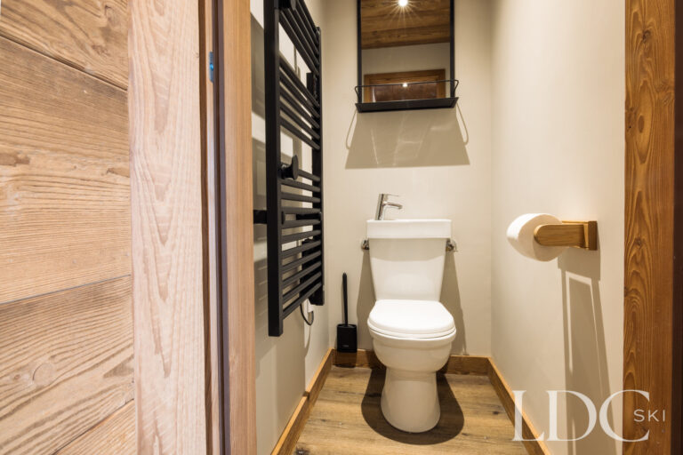 Downstairs WC with timber detailing at La Florette