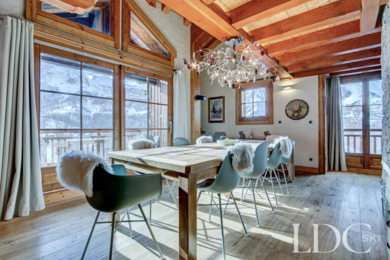 Dining area with large windows overlooking the mountains at Nant Giraud in St Martin de Belleville