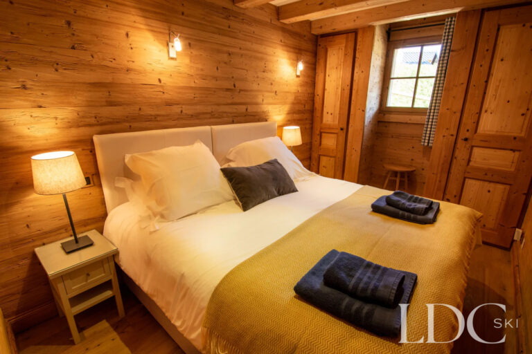 Traditional Alpine double bedroom at Nant Giraud in St Martin de Belleville