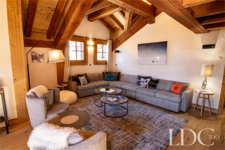 Comfortable lounge with exposed beams and traditional Alpine character at Nant Giraud