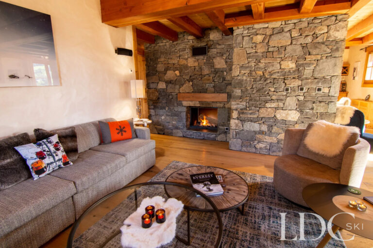 Comfortable lounge centred around a large stone fireplace at Nant Giraud