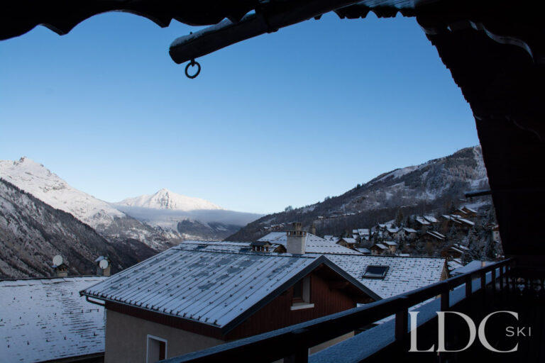 Snowy mountain and village view from the balcony at Perce Neige in St Martin de Belleville