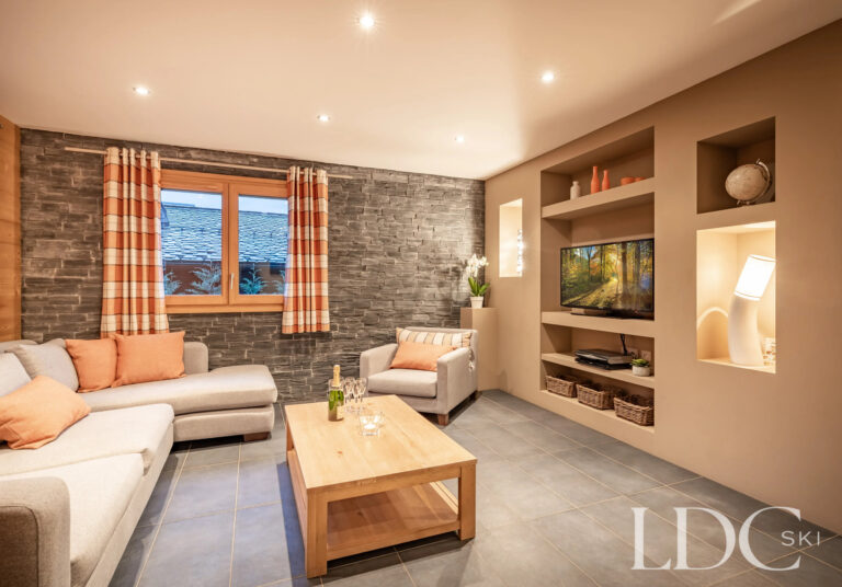 Contemporary living room with mountain views at Petit Sapin in Morzine
