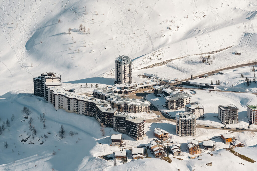 Aerial view of accommodation and ski slopes high above Tignes. © Andy Parant