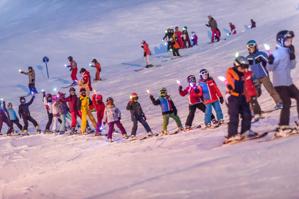Colourful group of skiers taking part in an event on the slopes of Tignes. © Andy Parant