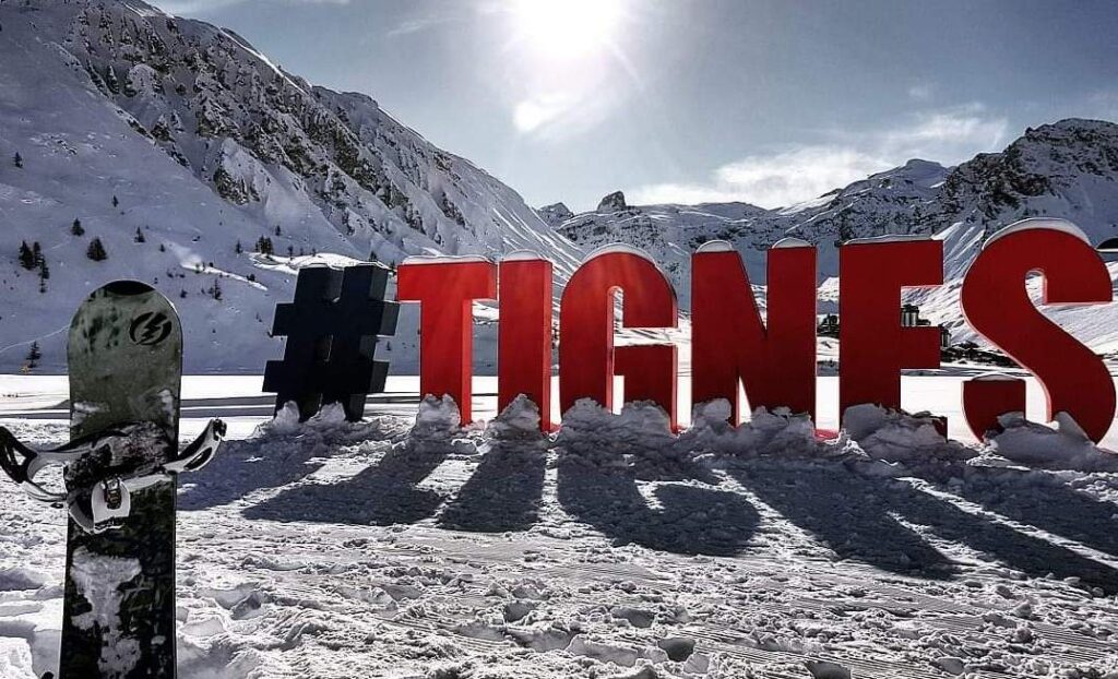 Tignes sign overlooking the snow-covered resort
