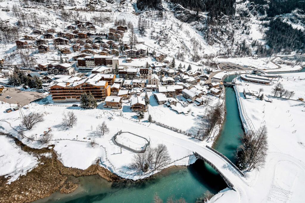 Aerial view across Tignes and its snow-covered mountain valley. © Andy Parant