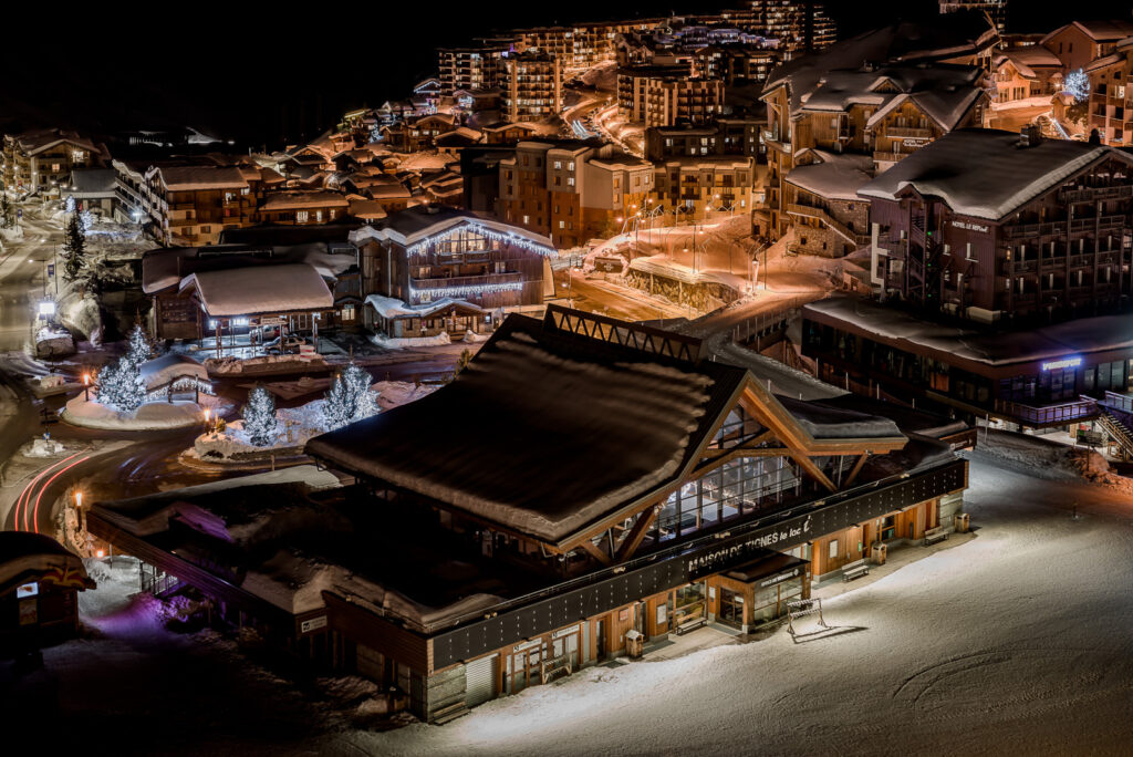 Tignes illuminated at night beneath the surrounding mountains. © Andy Parant